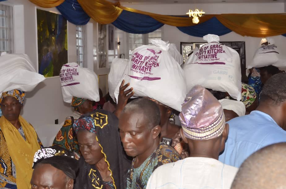 Hand of Grace food packs visible during active distribution