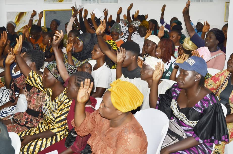 Community members actively participating during Hand of Grace outreach
