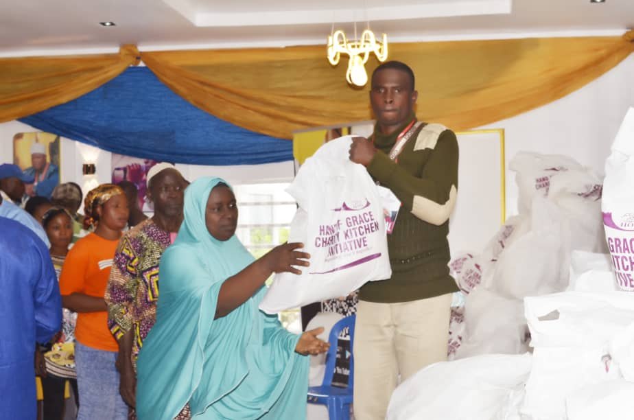 A beneficiary receiving a Hand of Grace food pack