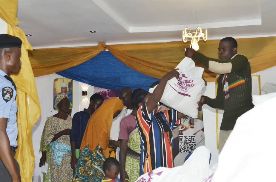 A beneficiary collecting a Hand of Grace food pack