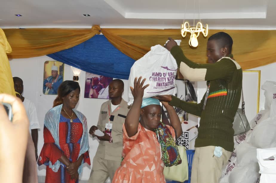 Hand of Grace support being handed to a beneficiary
