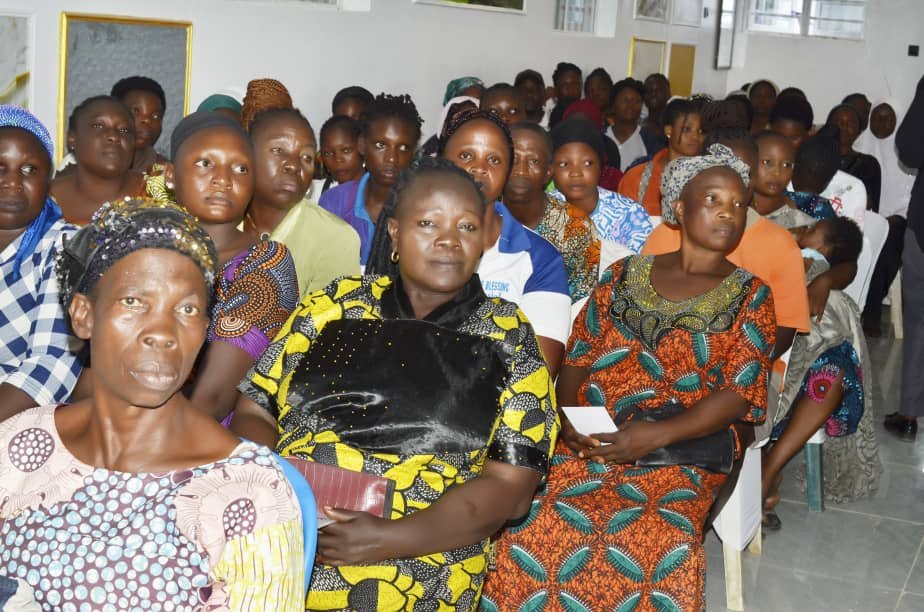 Community participants seated during Hand of Grace outreach