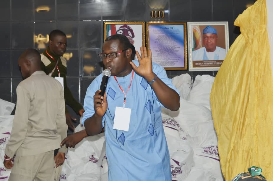 A programme representative speaking during Hand of Grace outreach