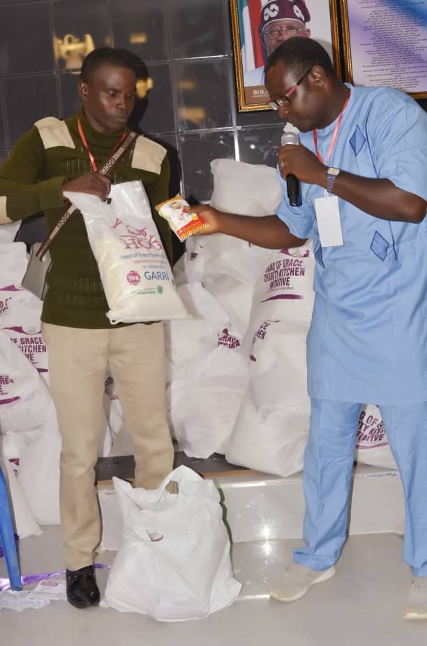 Food support items being presented during the Hand of Grace outreach
