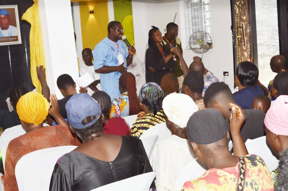 A Hand of Grace representative addressing participants